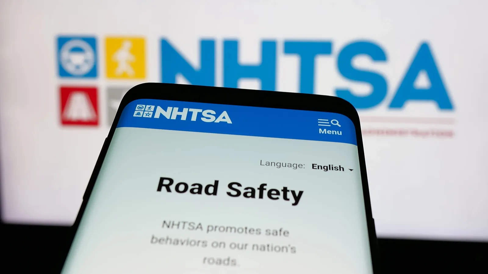 Cropped view of a smartphone with the website of the National Highway Traffic Safety Administration.