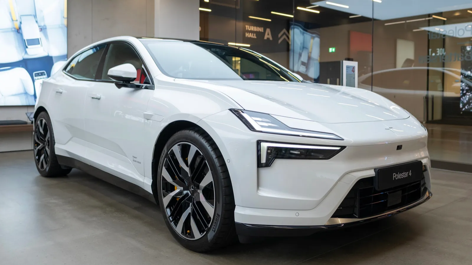 White Polestar 4 displayed at a showroom