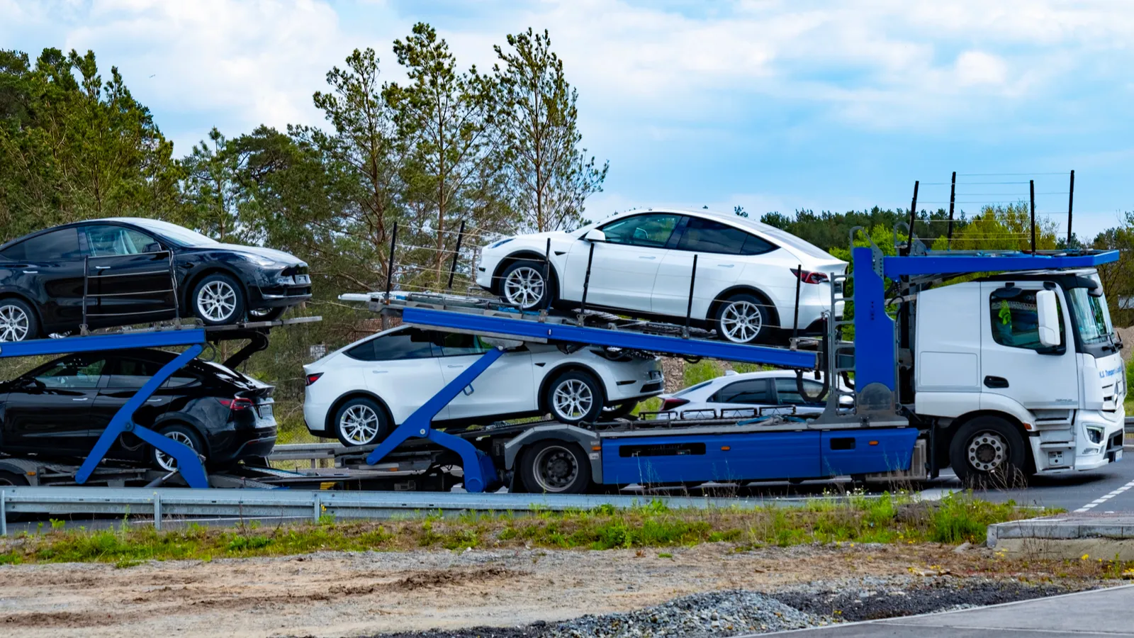 Car transporter carrier transports new Tesla vehicles from Gigafactory Berlin 