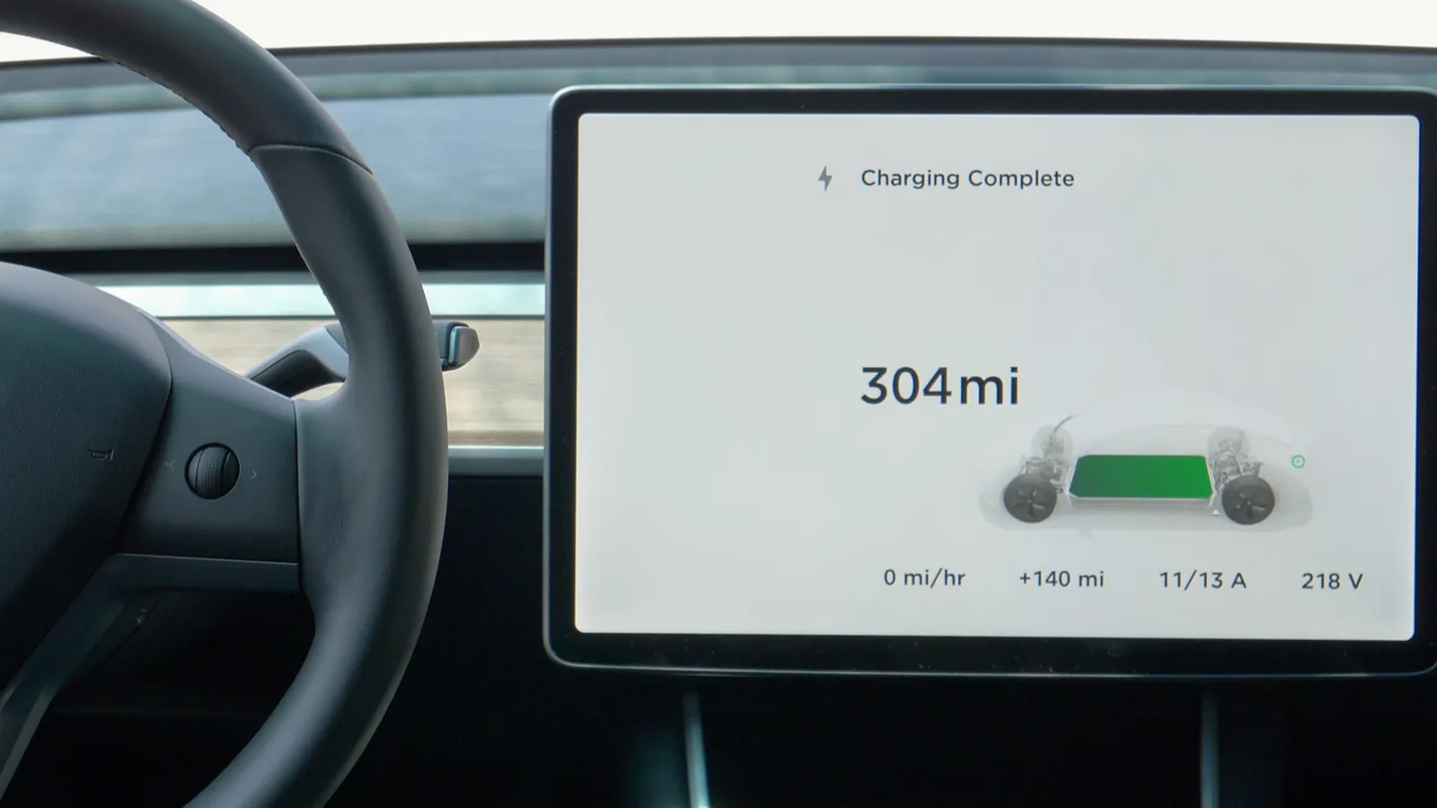 Touchscreen inside a Tesla notifies the car battery range