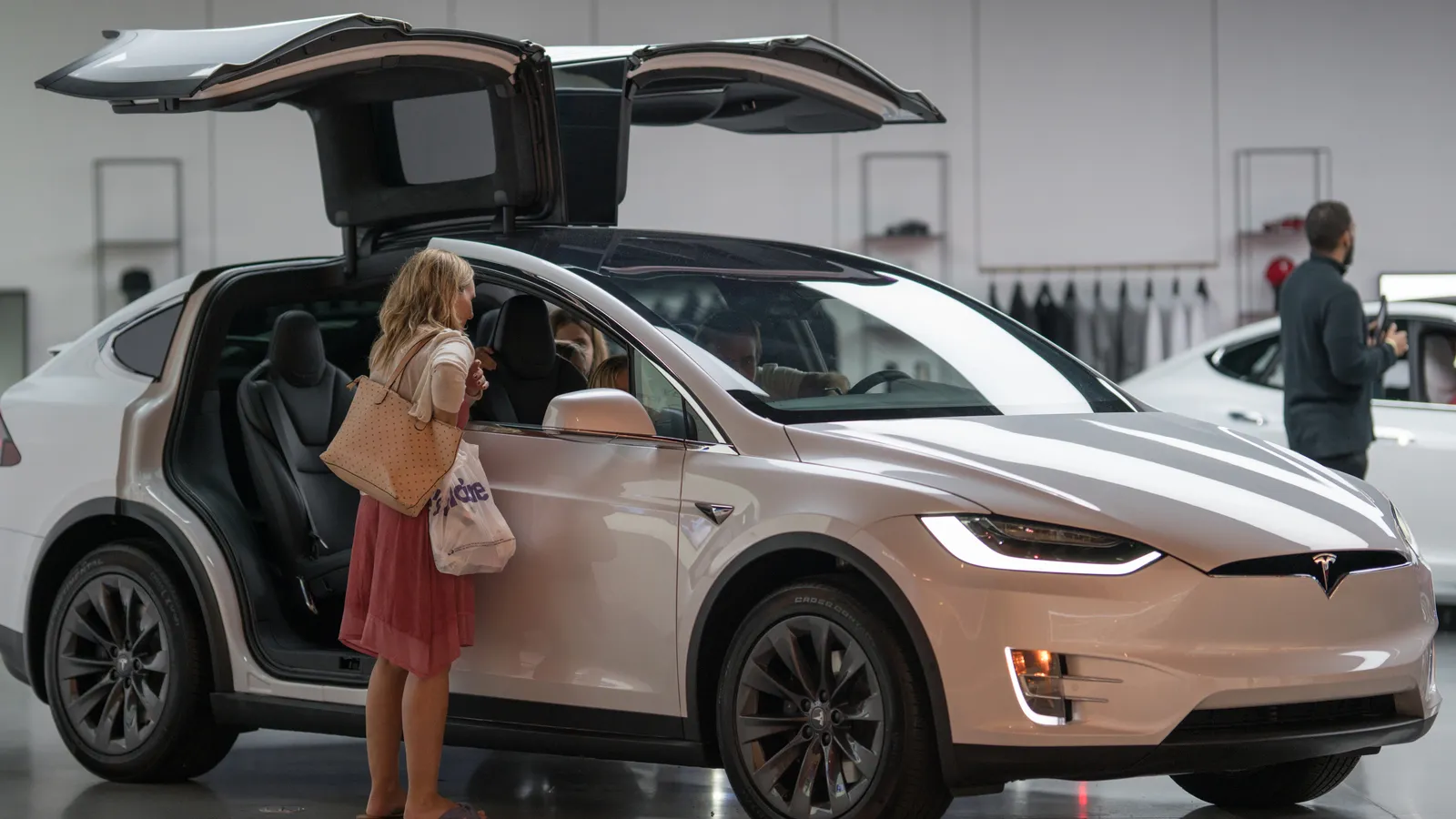 Family shopping for a new Tesla Model X at the display