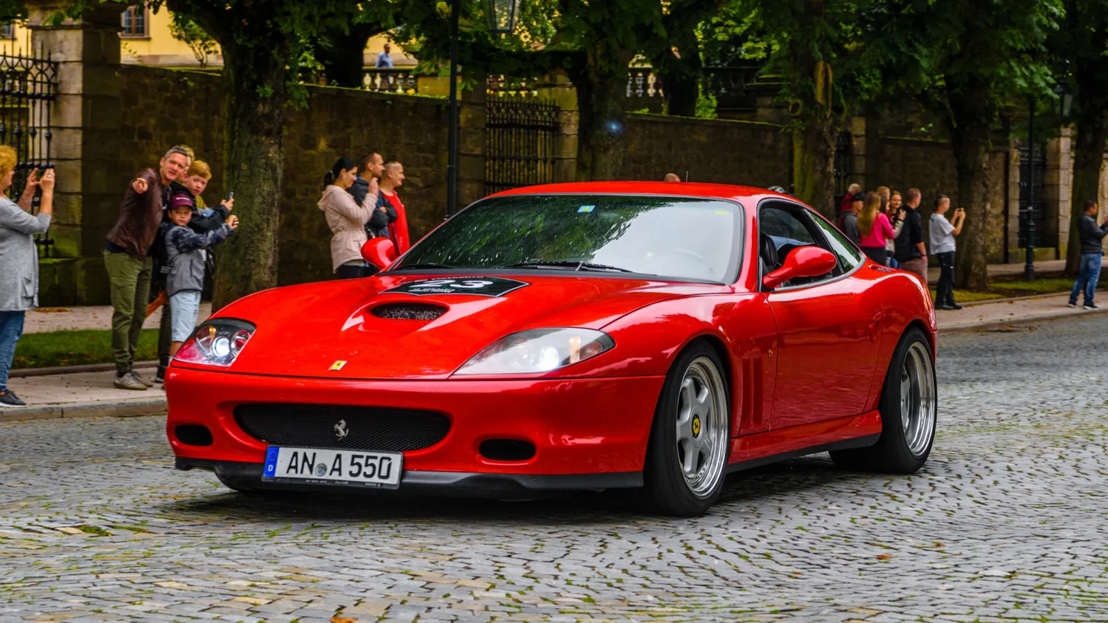 Red Ferrari 550 Maranello coupe on streets