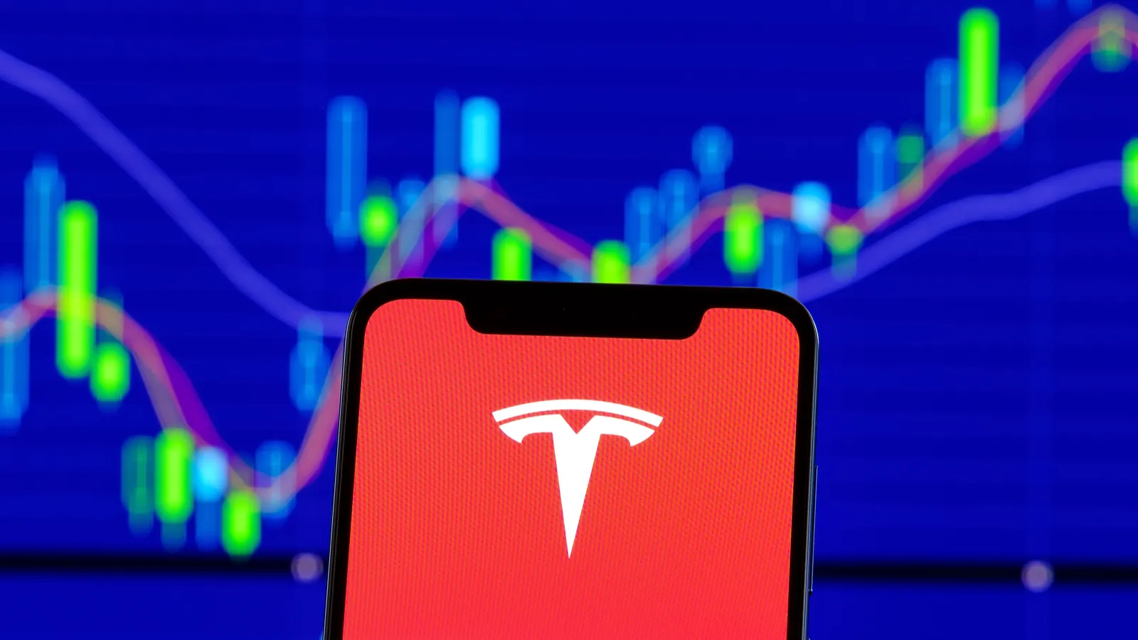 Tesla motors logo on cell phone