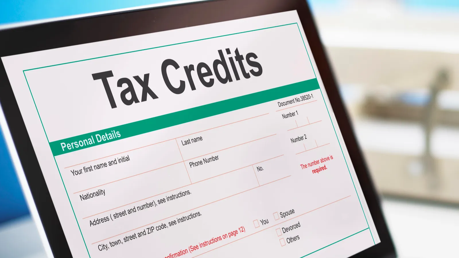 Tax credits form displayed on a laptop screen.