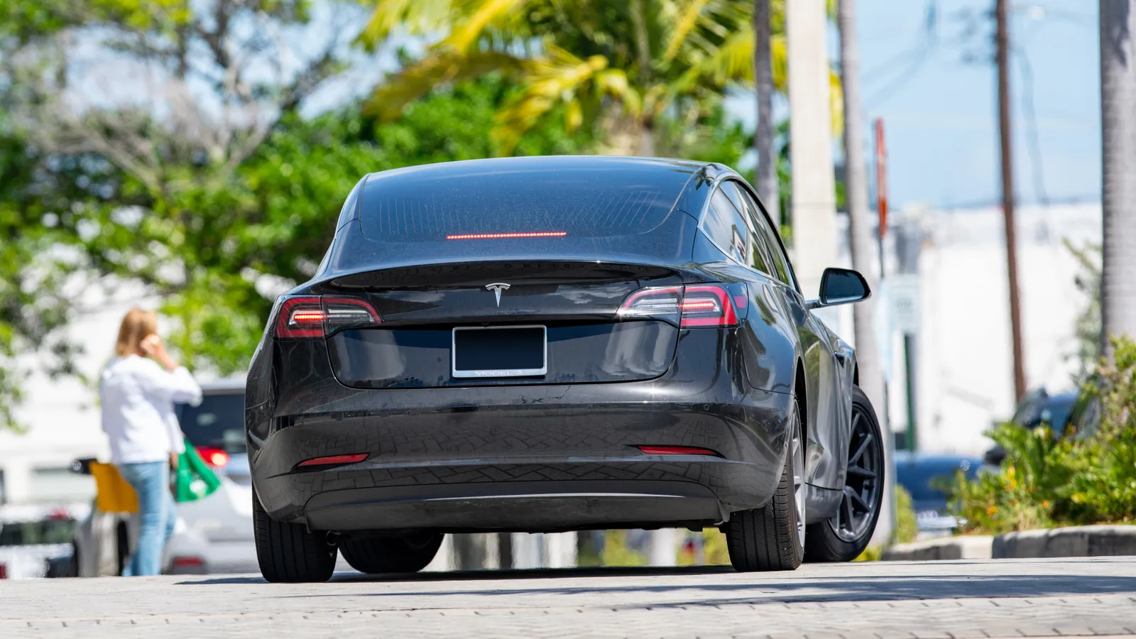 Rear view of a black Tesla Model 3