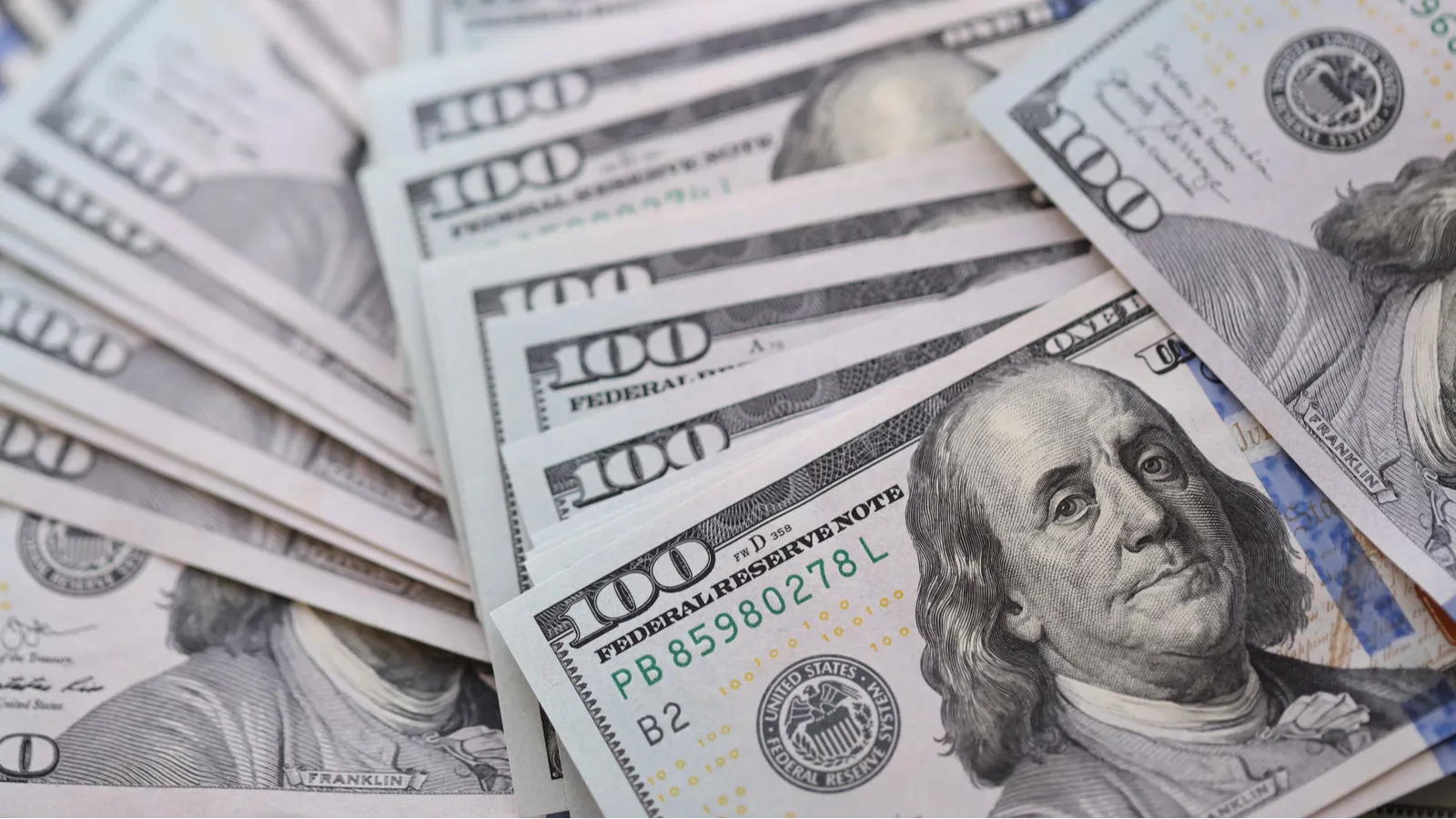 Big amount of US hundred dollar bills close up