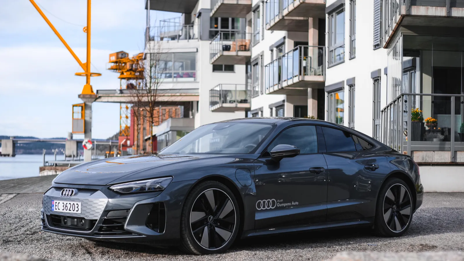 Gray Audi e-tron GT parked outside a building